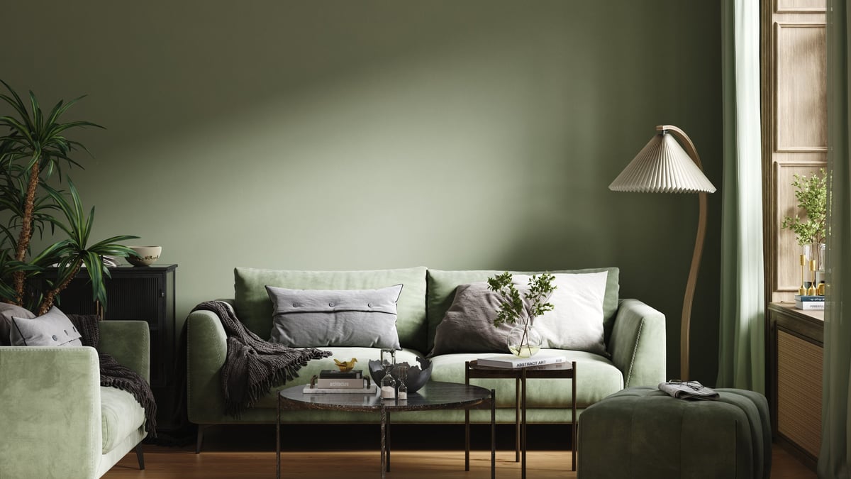 Furnished cozy dark green living room interior